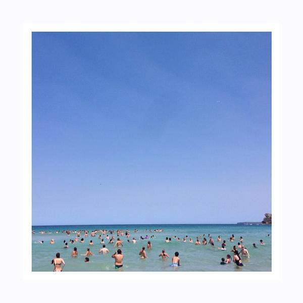 People frolicking in the ocean. Photo print by Instagrammer, Fashion Blogger Jenna Isaacman.  This print and another 11 for sale on the Impressed Print Shop